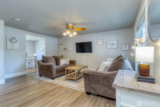 2335 Hawk Dr, Walla Walla, WA 99362 - living area with light wood finished floors, baseboards, and ceiling fan