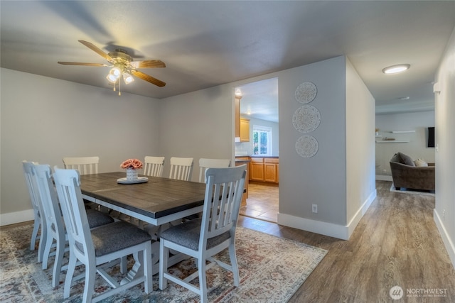 2335 Hawk Dr, Walla Walla, WA 99362 - dining space with baseboards, light wood finished floors, and a ceiling fan