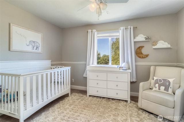 2335 Hawk Dr, Walla Walla, WA 99362 - carpeted bedroom with ceiling fan, baseboards, and a crib