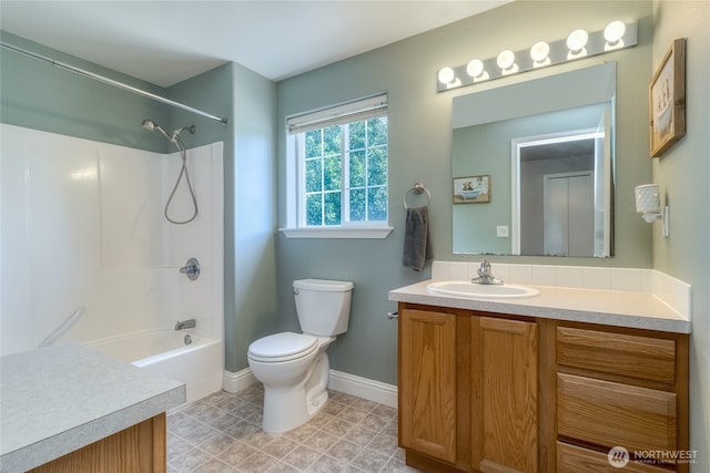 2335 Hawk Dr, Walla Walla, WA 99362 - full bath with washtub / shower combination, vanity, baseboards, and toilet