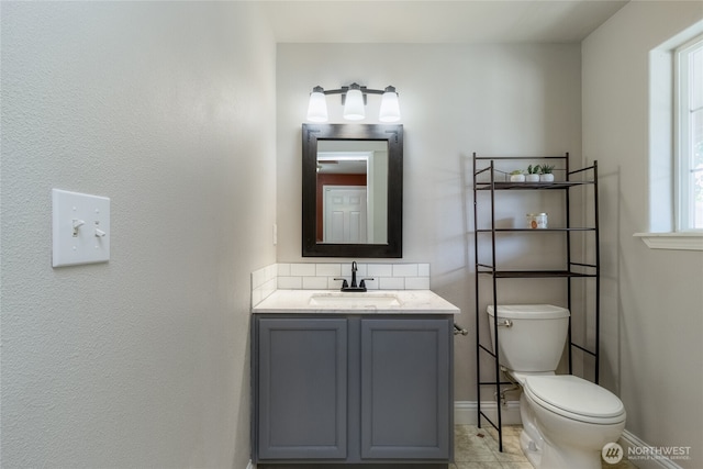 2335 Hawk Dr, Walla Walla, WA 99362 - bathroom featuring toilet, vanity, and baseboards