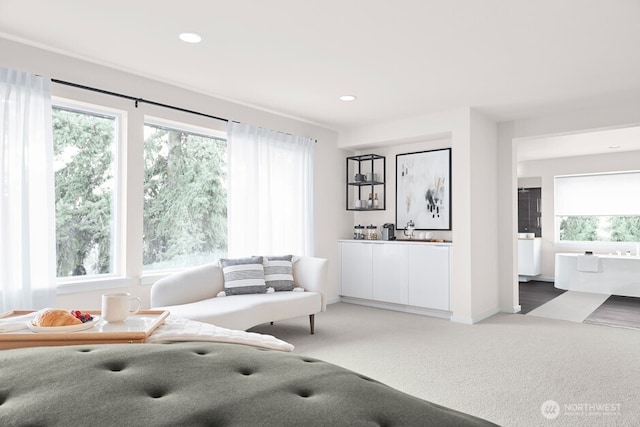 carpeted living room with baseboards and recessed lighting