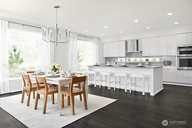 11811 SE 242nd Pl, Kent, WA 98030 - dining space featuring dark wood-type flooring, a notable chandelier, and recessed lighting