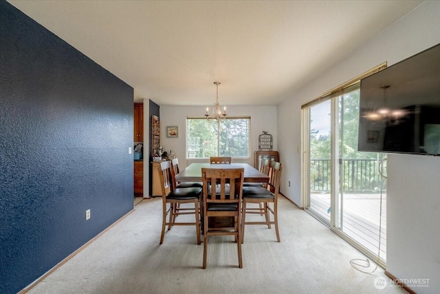 515 N 188th St, Shoreline, WA 98133 - dining area featuring a chandelier, light colored carpet, and a textured wall