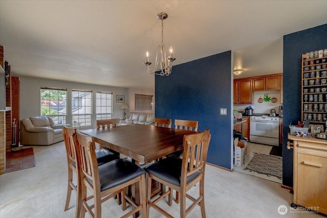 515 N 188th St, Shoreline, WA 98133 - dining room featuring a chandelier and light carpet