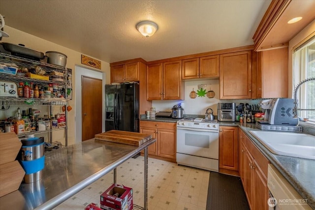 515 N 188th St, Shoreline, WA 98133 - kitchen featuring white appliances, brown cabinets, and light flooring