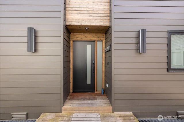 entrance to property featuring elevator