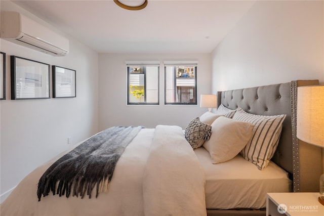 bedroom with an AC wall unit