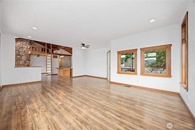 unfurnished living room featuring recessed lighting, ceiling fan, baseboards, and light wood finished floors