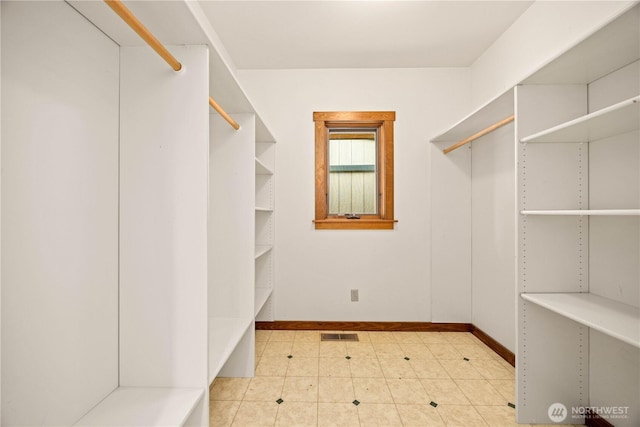 walk in closet with visible vents