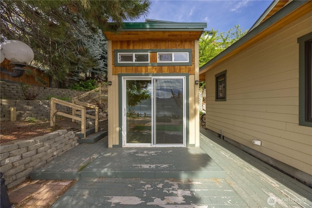 doorway to property with a wooden deck