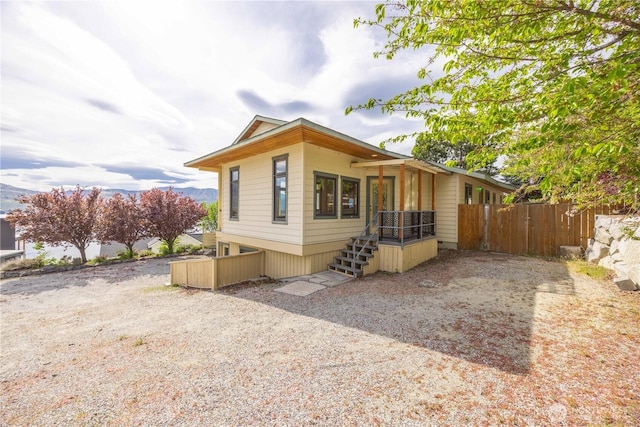 view of home's exterior with fence