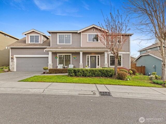 5258 S 285th St, Auburn, WA 98001 - craftsman house featuring a front yard, a porch, a shingled roof, and concrete driveway