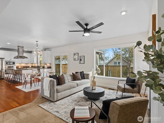 5258 S 285th St, Auburn, WA 98001 - living room featuring visible vents, ceiling fan with notable chandelier, recessed lighting, and a healthy amount of sunlight