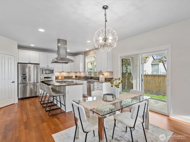 5258 S 285th St, Auburn, WA 98001 - dining room with a wealth of natural light, recessed lighting, a notable chandelier, and wood finished floors