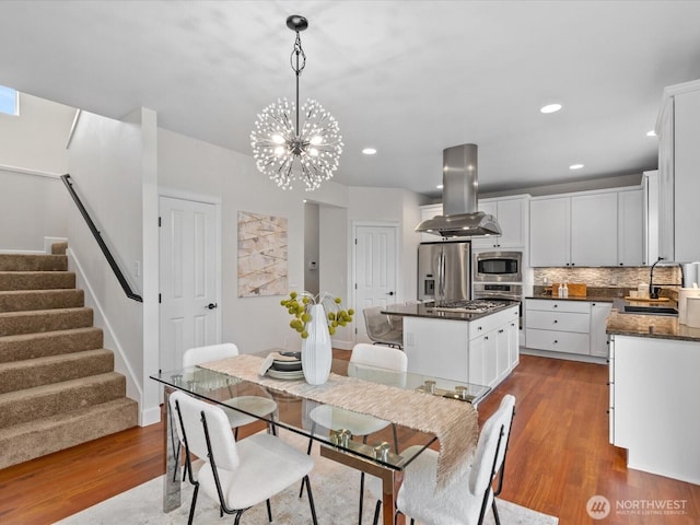 5258 S 285th St, Auburn, WA 98001 - dining space with dark wood-type flooring, recessed lighting, an inviting chandelier, and stairway