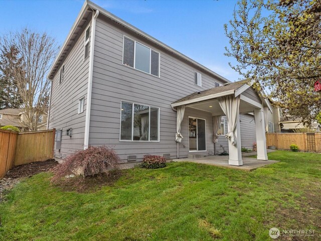 5258 S 285th St, Auburn, WA 98001 - back of property with a patio, a fenced backyard, and a lawn