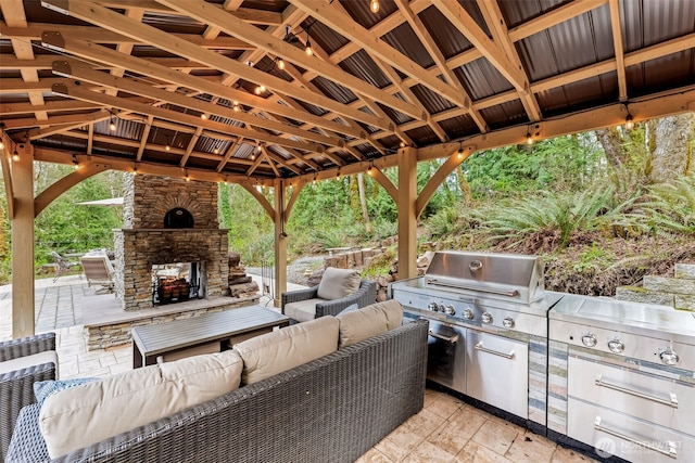 11232 Crescent Valley Dr NW, Gig Harbor, WA 98332 - view of patio featuring a gazebo, heating unit, an outdoor living space with a fireplace, grilling area, and an outdoor kitchen