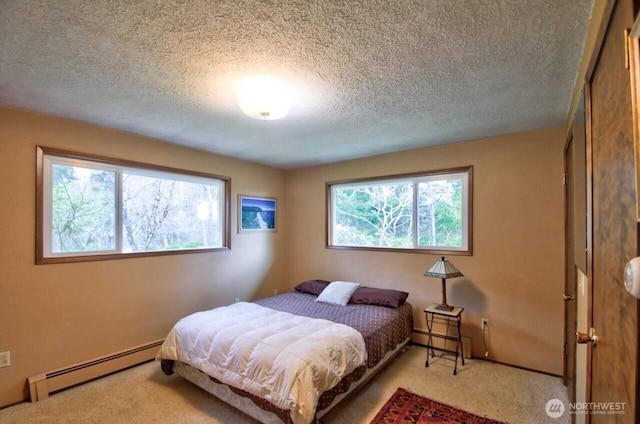 11202 Littlerock Rd SW, Olympia, WA 98512 - carpeted bedroom with a baseboard radiator and a textured ceiling