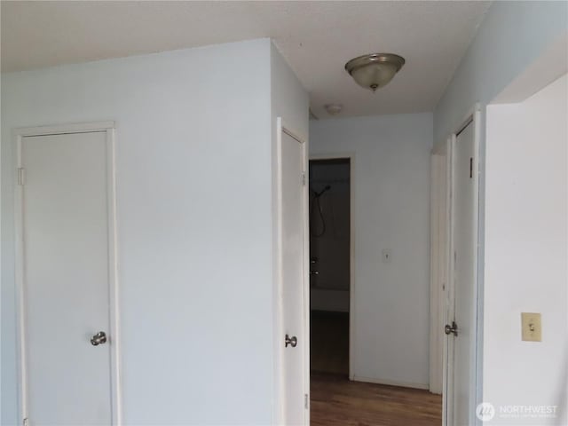 corridor with wood finished floors