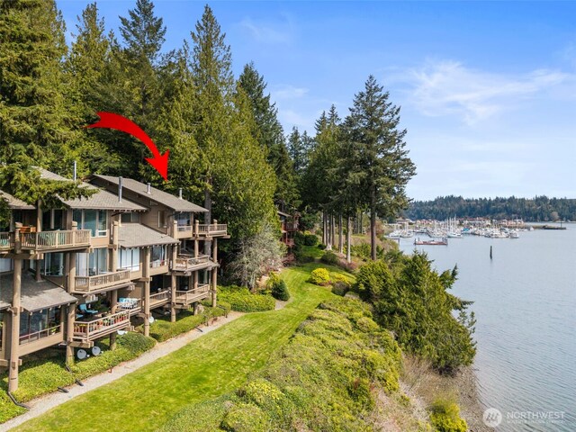 birds eye view of property with a water view