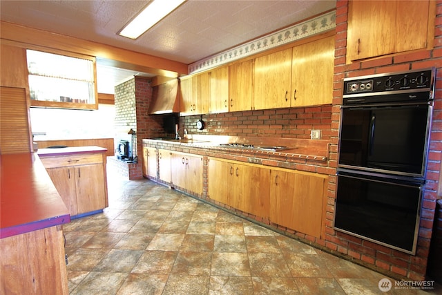 115 Kakela Rd, Winlock, WA 98596 - kitchen with stone finish floors, a sink, and light countertops