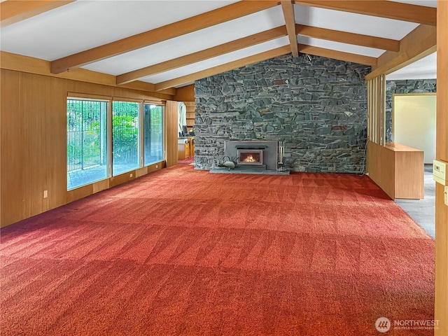 115 Kakela Rd, Winlock, WA 98596 - unfurnished living room with a lit fireplace and carpet flooring