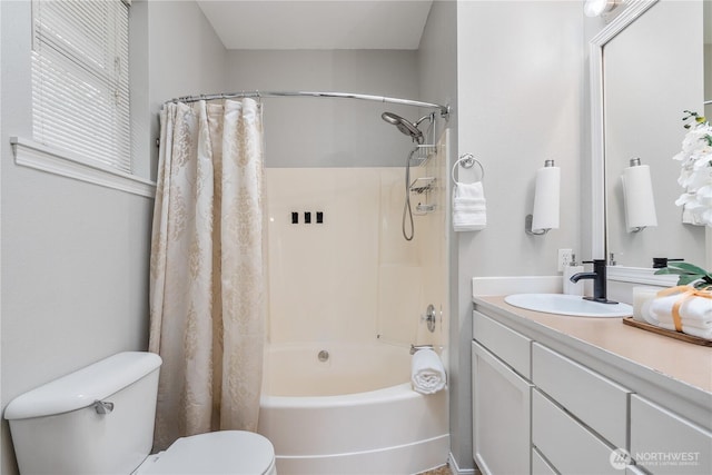 bathroom featuring toilet, shower / bathtub combination with curtain, and vanity