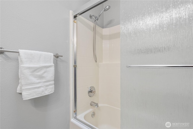 full bath featuring shower / bath combination with glass door