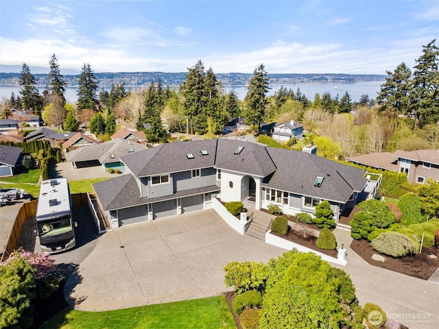 aerial view featuring a water view and a residential view