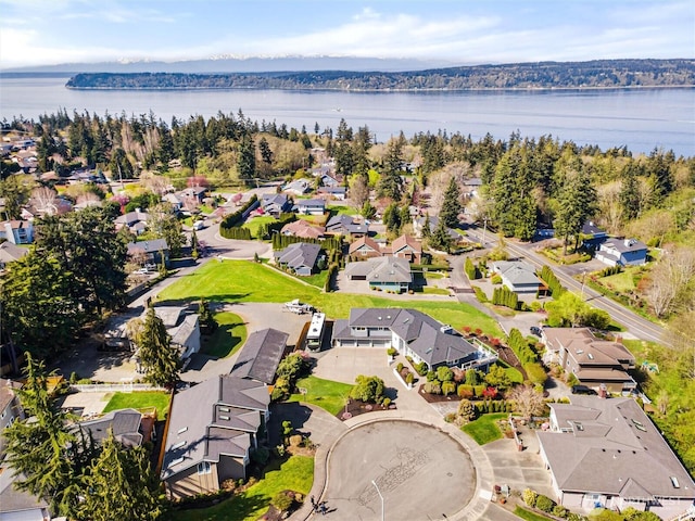 bird's eye view featuring a water view and a residential view