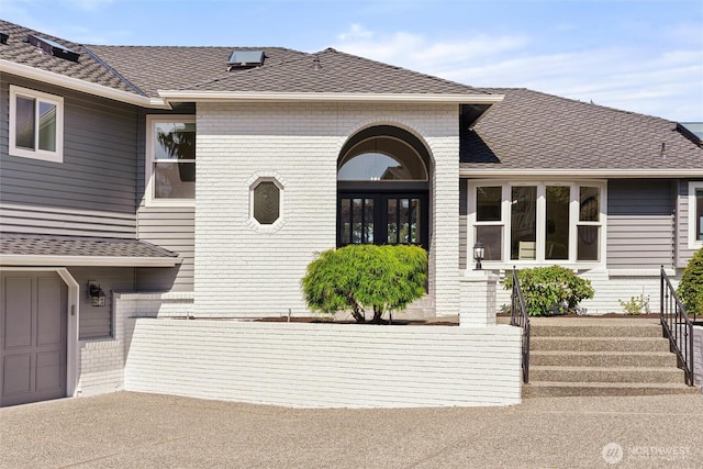 view of front of house featuring brick siding