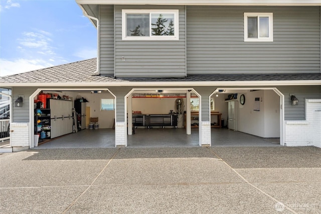 garage with concrete driveway