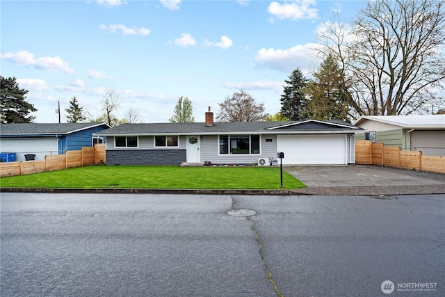 single story home with a front lawn, fence, a garage, and driveway