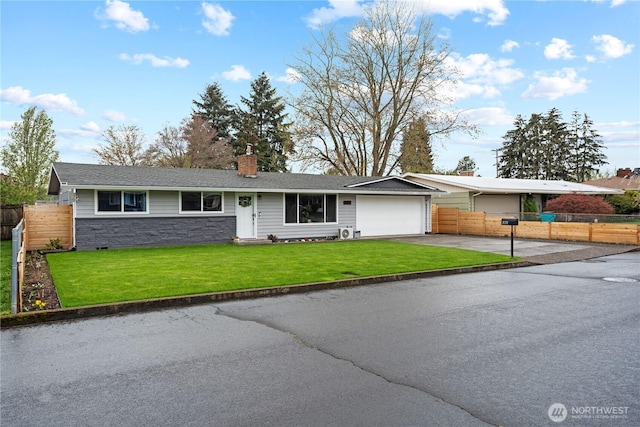 single story home featuring driveway, stone siding, an attached garage, a front yard, and fence