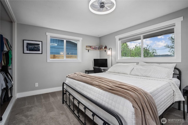 carpeted bedroom with baseboards