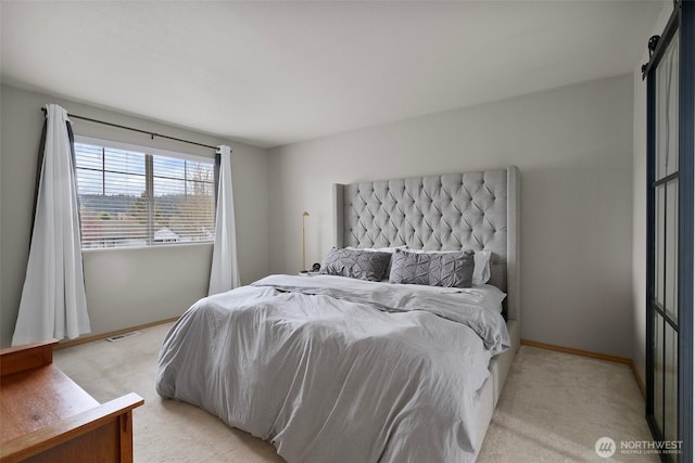 bedroom with light carpet, baseboards, and visible vents