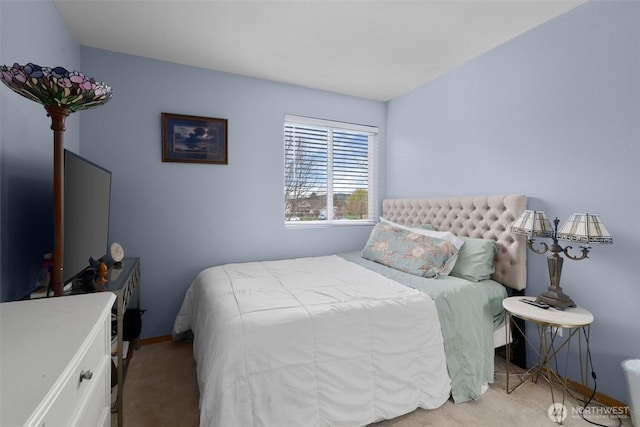 carpeted bedroom with baseboards