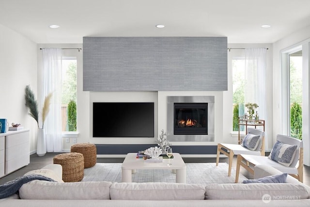 11911 SE 242nd Pl, Kent, WA 98030 - living room featuring baseboards, a glass covered fireplace, and recessed lighting