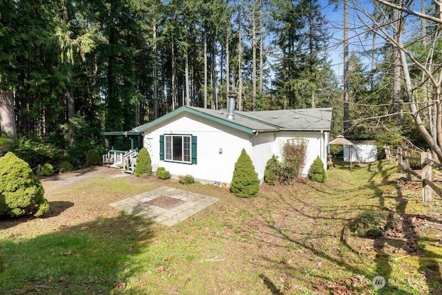 11712 114th Avenue Ct, Anderson Island, WA 98303 - view of side of property with crawl space and a lawn