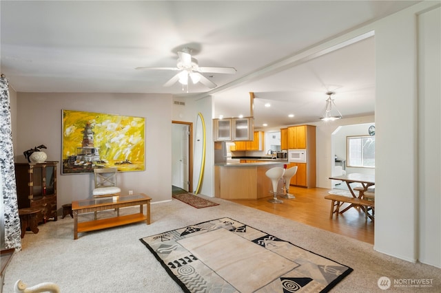 11712 114th Avenue Ct, Anderson Island, WA 98303 - living room featuring visible vents, a ceiling fan, recessed lighting, vaulted ceiling, and light carpet
