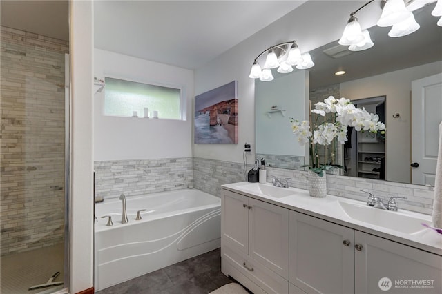 11724 62nd Ave SE, Snohomish, WA 98296 - bathroom with tile patterned floors, a bath, double vanity, a shower stall, and tile walls