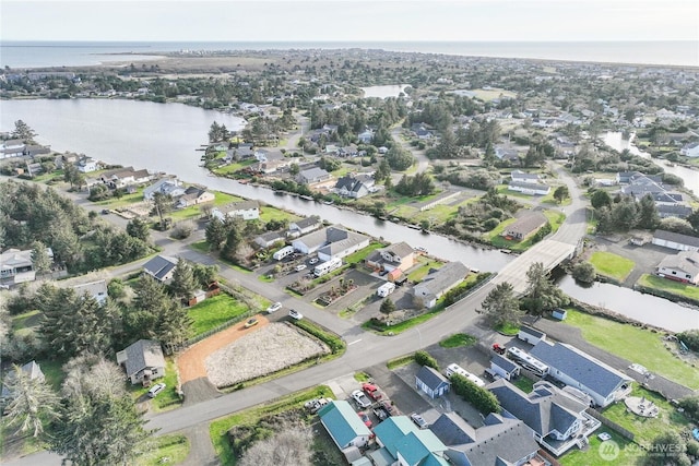 birds eye view of property featuring a residential view and a water view
