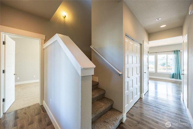 staircase with baseboards, recessed lighting, and wood finished floors