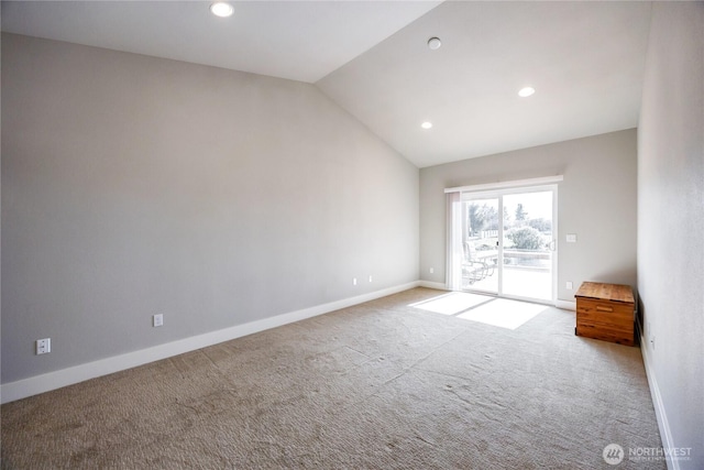 carpeted empty room featuring baseboards, vaulted ceiling, and recessed lighting
