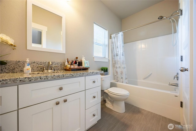 full bath featuring shower / tub combo, vanity, and toilet