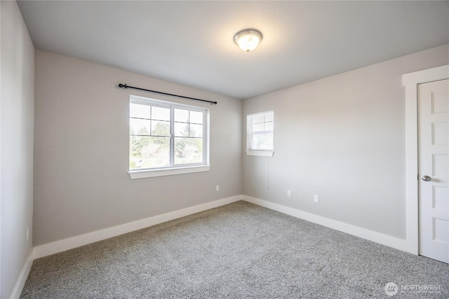 empty room with carpet flooring and baseboards