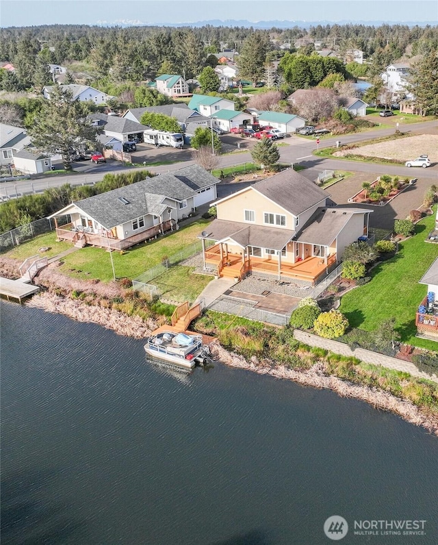 bird's eye view featuring a residential view and a water view