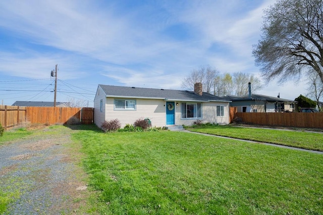 ranch-style home featuring entry steps, a front lawn, fence, and a chimney