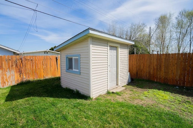 view of shed featuring a fenced backyard